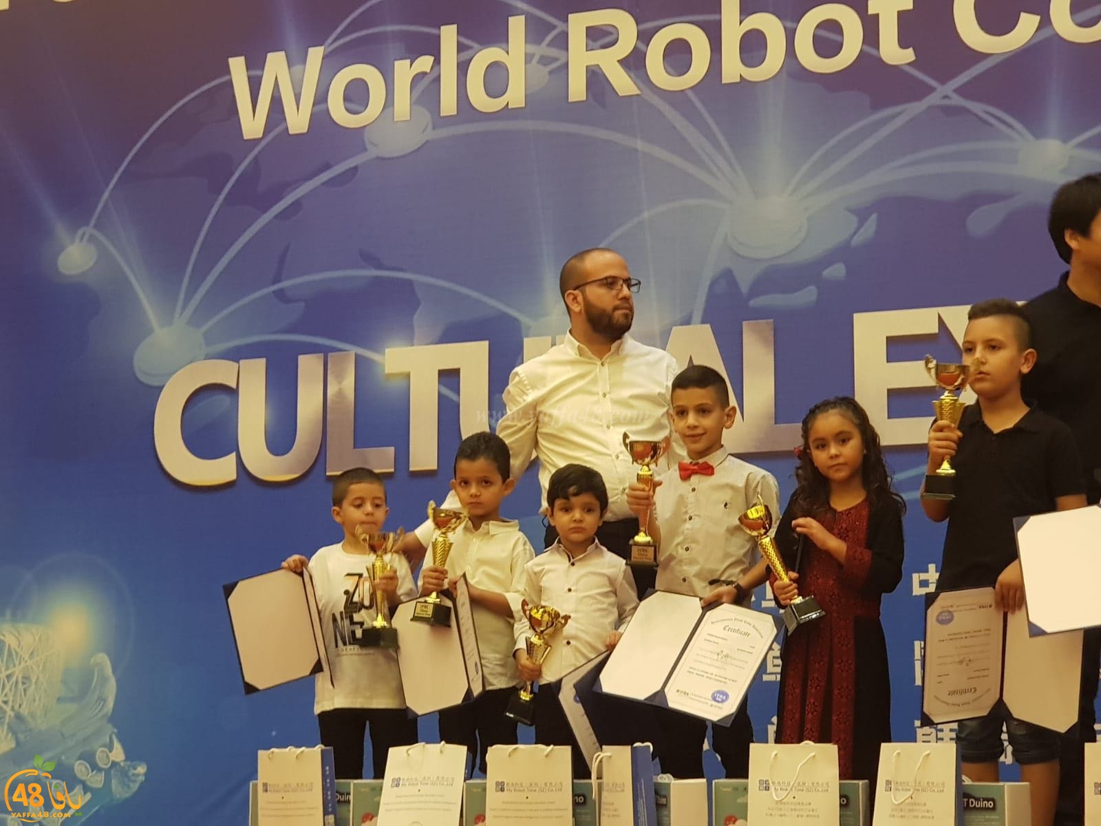 صور: طلاب من اللد والرملة يشاركون في مسابقة الروبوتات العالمية بالصين