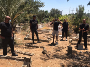  بالصور: شباب كشاف النادي الاسلامي في مشروع لتنظيف مقبرة طاسو